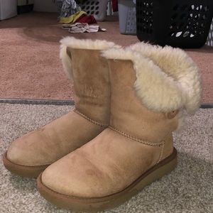 Tan Ugg boots with light beige for the fur.